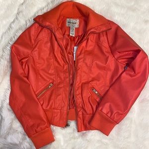 Body Central coral colored leather jacket